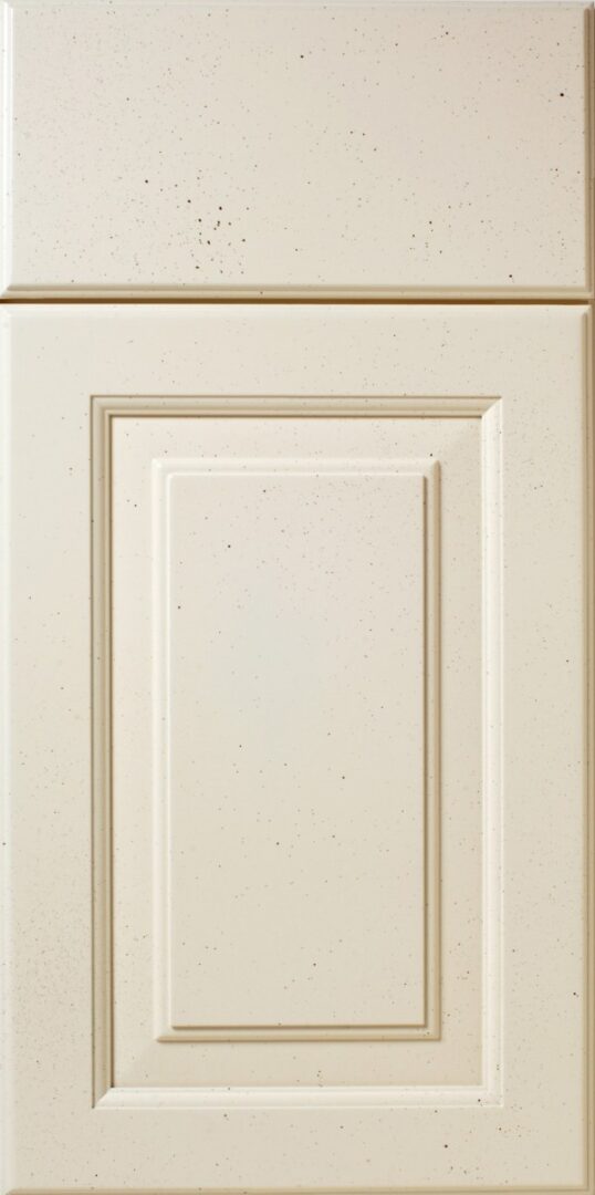 Close-up of a S554 LONGSHORE kitchen cabinet door with a recessed panel design and speckled finish.