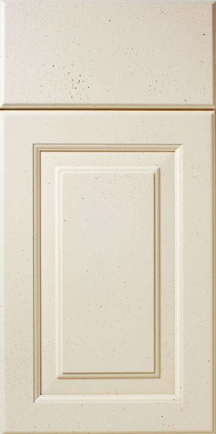 Close-up view of a speckled, cream-colored S583 LONGSHORE cabinet door with a recessed center panel.