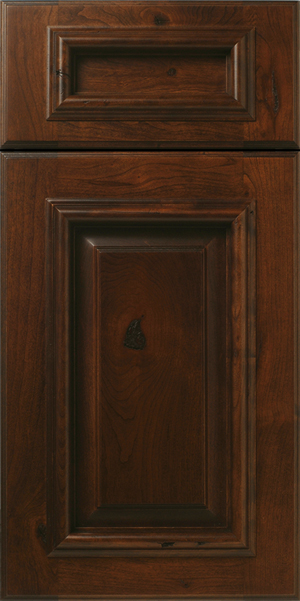 A close-up of a S613 BARNUM cabinet door with raised panels.