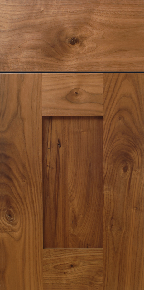 Richly grained wooden surface with paneling details.